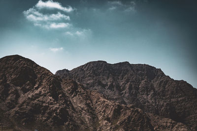 Low angle view of rock formation against sky