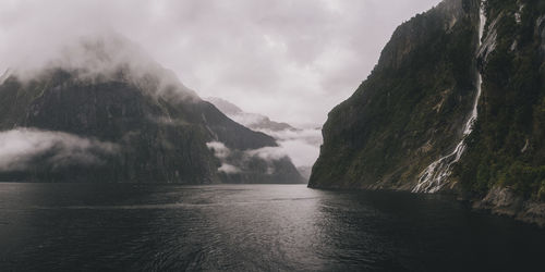 Panoramic view of waterfalls & mountains at milford sound, new zealand