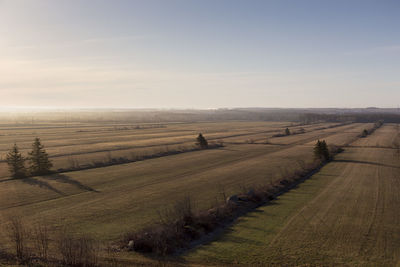 High angle view of fields seen during a beautiful spring  morning with farm buildings on the horizon