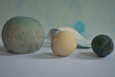 Close-up of fruits on table against white background