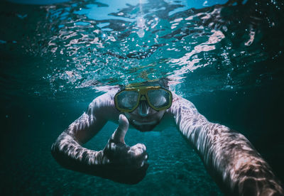 Man swimming in sea