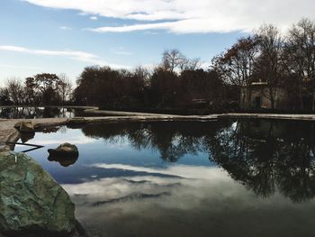 Reflection of trees in lake against sky