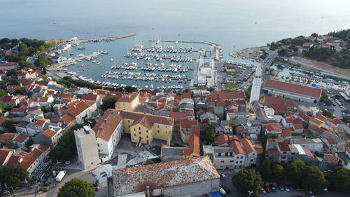 High angle view of townscape by sea