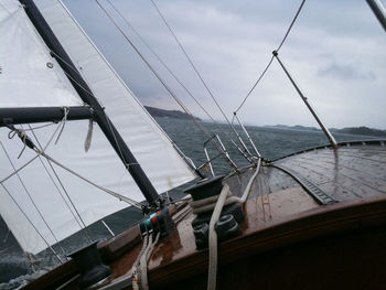 Boat sailing on sea against sky