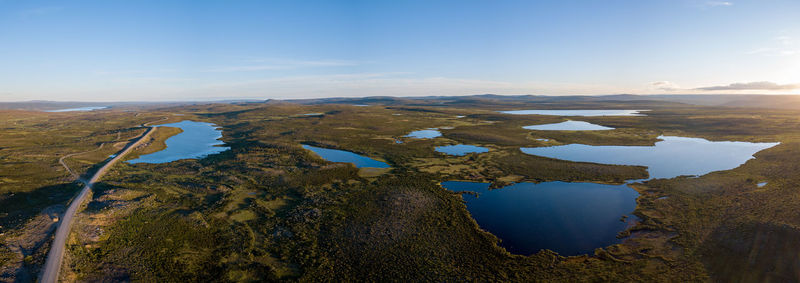 Aerial view of lake against cloudy sky