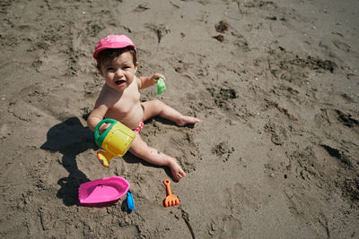 High angle view of girl toy on beach