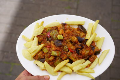 High angle view of person preparing food in plate