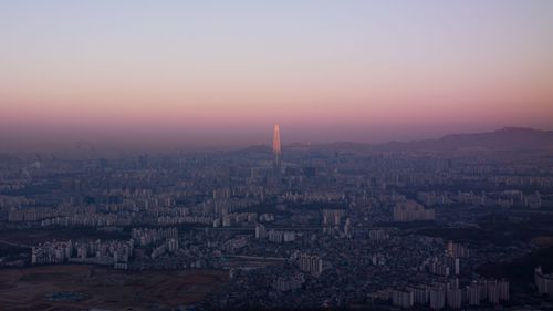 Cityscape against sky during sunset