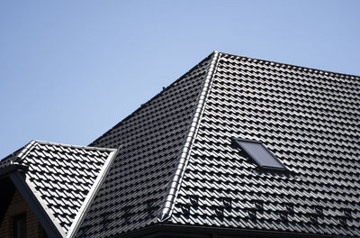 Low angle view of modern building against clear sky