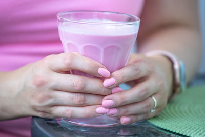 Close-up of woman drinking glass