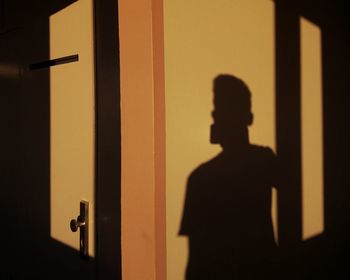 Shadow of man on door