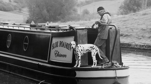 Rear view of a man on boat