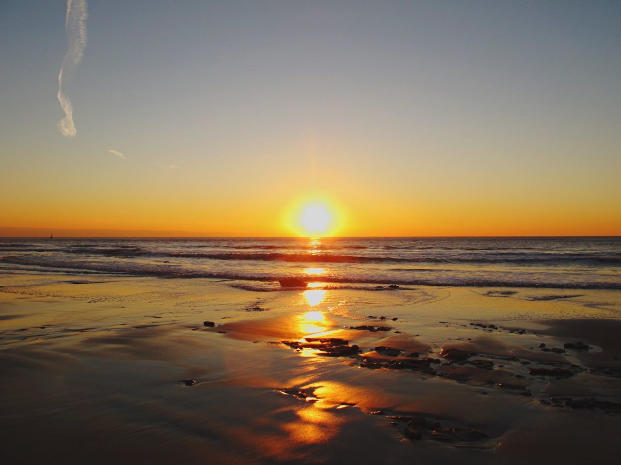 sea, sunset, horizon over water, sun, beauty in nature, scenics, beach, sky, nature, tranquil scene, reflection, tranquility, idyllic, water, outdoors, no people, sand, day