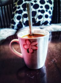 Close-up of coffee cup on table