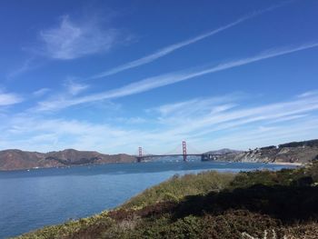 Bridge over sea against sky