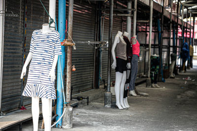 Rear view of woman walking on street in city