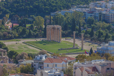 High angle view of buildings and trees in city