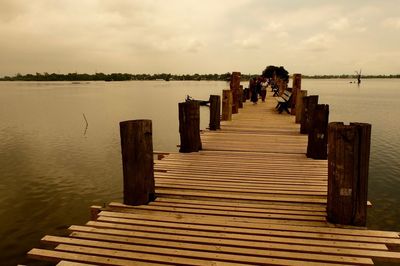 Wooden jetty leading to calm sea