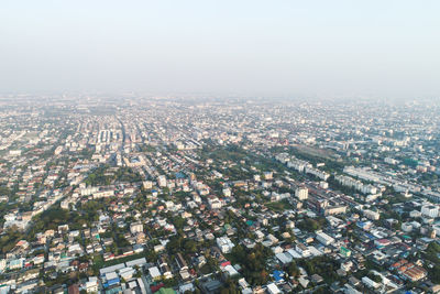 High angle view of city buildings against sky