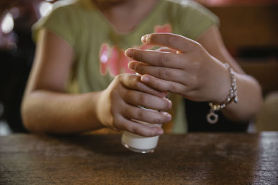 Midsection of woman holding ice cream