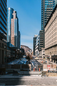 Modern buildings in city against sky