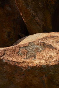 Close-up of rusty metal on rock