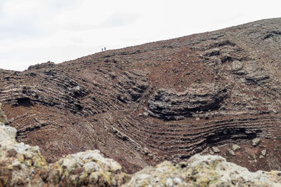 Rock formations on landscape against sky