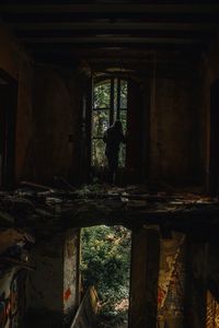 Man standing in abandoned building