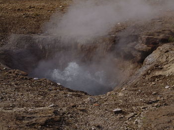 Smoke emitting from volcanic mountain