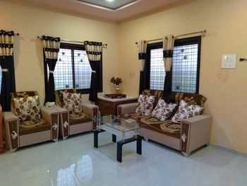 Table and chairs on bed at home
