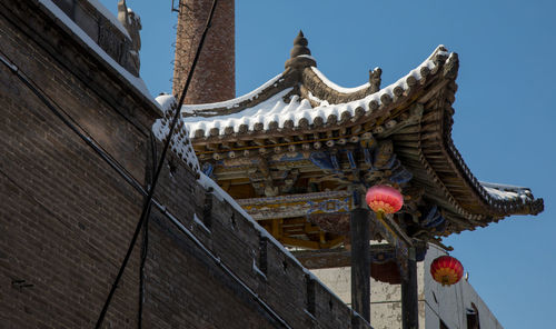 Low angle view of traditional building against sky