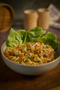 Pangsit mie or wheat noodle with diced chicken meat - portrait close