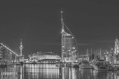 Illuminated buildings in city at night