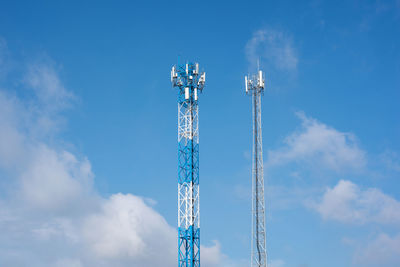 Wireless communication antenna transmitter. telecommunication towers with blue sky.