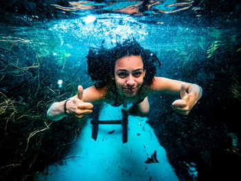 Portrait of woman swimming in sea