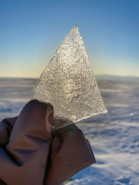 Low angle view of woman with umbrella