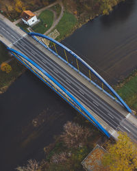 High angle view of bridge over road by lake