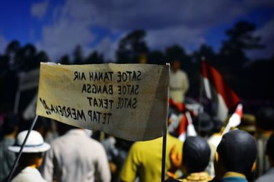 Rear view of people on street in city