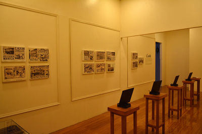Empty chairs and tables against wall at home