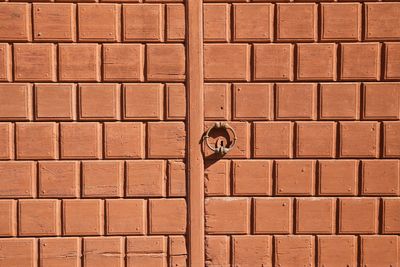 Full length of girl against brick wall