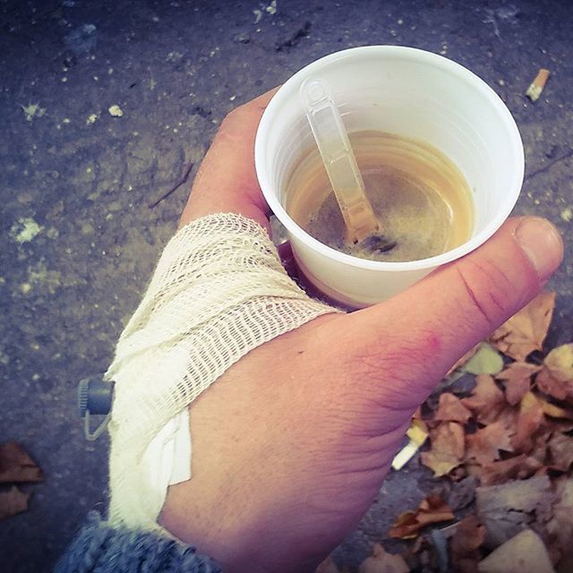 high angle view, personal perspective, person, part of, close-up, holding, cropped, directly above, stone - object, day, low section, lifestyles, food and drink, outdoors, white color, coffee cup