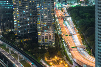 High angle view of light trails on road at night