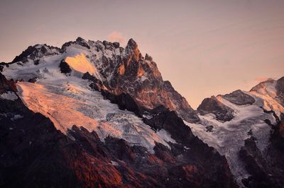 Scenic view of mountains against sky during sunset