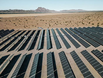 Scenic view of desert and solar panels farm