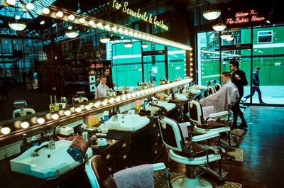 Man in illuminated room