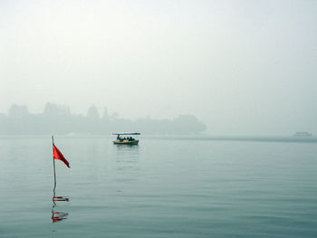 Scenic view of sea against sky during foggy weather