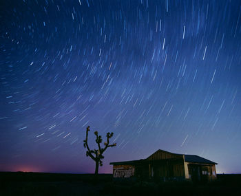 Scenic view of field against sky at night