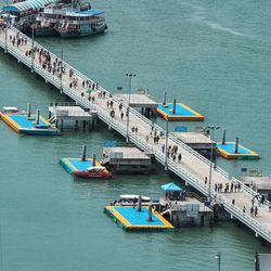 High angle view of people on pier in sea