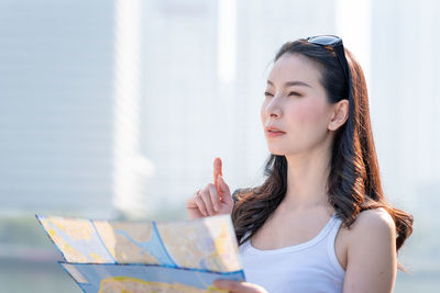 Portrait of young woman looking away