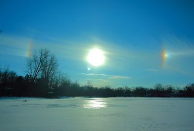 Scenic view of frozen landscape against sky